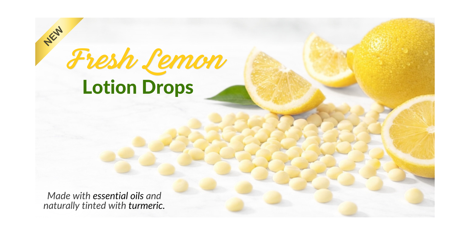 Fresh Lemon Lotion Drops arranged on a clean countertop with fresh lemon slices and a whole lemon. Overlay text reads “New,” “Fresh Lemon Lotion Drops,” and “Made with essential oils and naturally tinted with turmeric.”